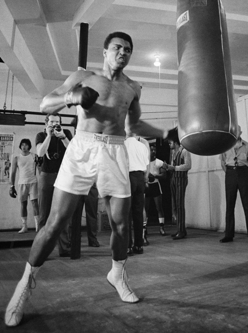Muhammad Ali working the heavy bag in his Miami gym in 1971